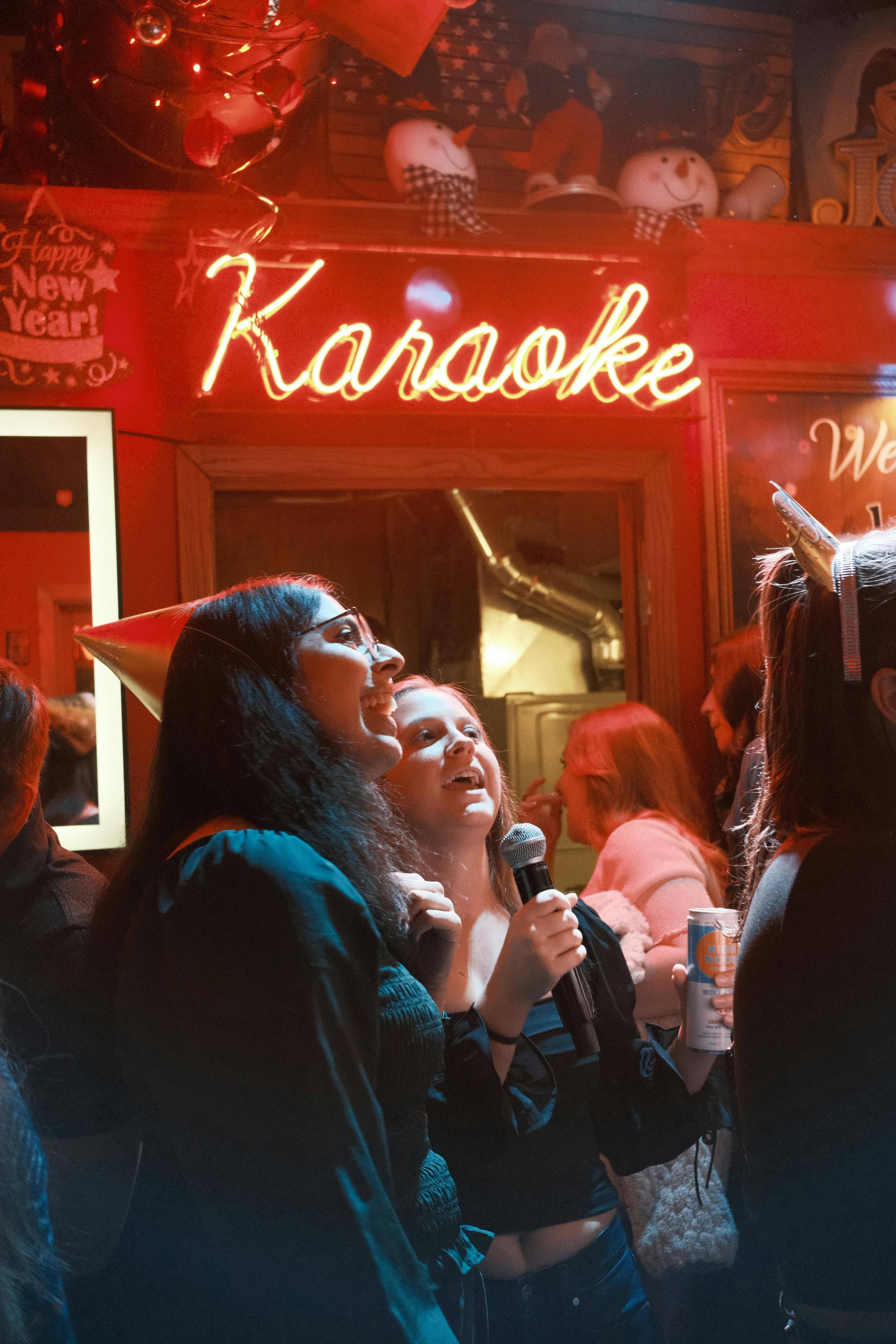 People having a good time singing Karaoke together,